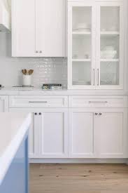 white shaker kitchen cabinets accented
