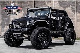 Black 4 Door Jeep Wrangler 2017 2016 Black Jeep Jk Customized And Modified Nitto Mud Grappler Tires Black On Black Wheels Jeep Wrangler Jeep Wrangler Unlimited Jeep