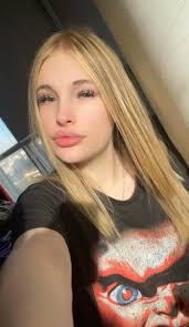 I would really appreciate it if someone could brighten the left eye of the  woman in the black dress. Her makeup makes her look like she has a black  eye. Thank you