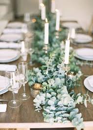 Eucalyptus Runner And Simple White Candle Sticks For Christmas Dinner Table Eucalyptus Wedding Decor Wedding Table Settings Table Runners Wedding