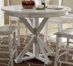 It's supported by a rustic pedestal. Willow Distressed White Round Counter Height Dining Table From Progressive Furniture Coleman Furniture