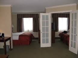 King size bed and 2 single beds bath: 2 Bedroom Suite Picture Of Clarion Inn Suites At The Outlets Of Lake George Tripadvisor