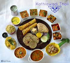 Desi Fiesta Kathiawadi Thali Gujarati Thali Gujarati Bhano Indian Food Recipes Gujarati Cuisine Gujarati Thali