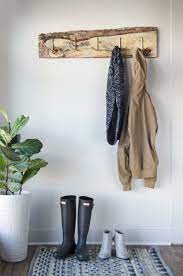 Old Wood Board Gets New Life As A Gorgeous Coat Rack Diy Coat Rack Rustic Coat Rack Diy Coat