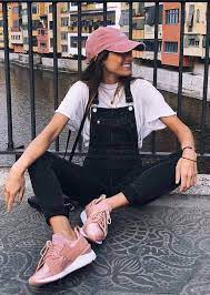 Spring Outfit Idea Pink Hat Tee Denim Jumpsuit Sneakers Street Style Street Style Chic Street Style Trends