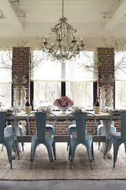 Love The Hard Vs Soft The Industrial Metal Chairs And The Fantastic Chandelier With The Brick And The Florals And The Et Dining Room Makeover Home Home Decor