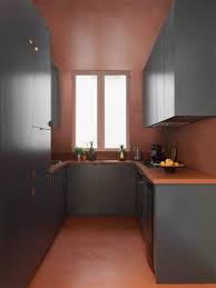 The pantry and refrigerator occupy the opposite wall, centralizing food storage. Eight Compact U Shaped Kitchens Designed By Architects