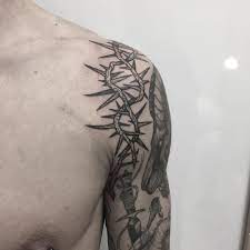 Crown tattoos can be tattooed anywhere on the body due to the variation of different sizes and designs. Crown Of Thorns Tattoo On The Shoulder Tattoogrid Net