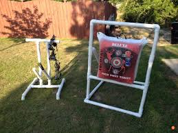 Diy archery bow stand using 2x4's, ladder hangers, 18 magnetic strip and diy camera mount! How To Create Your Own Backyard Archery Paradise
