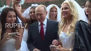 Putin is 66 years old, and most members of his inner circle are well into their 60s. Russia Putin Mobbed By Young Models Dressed As Brides Youtube