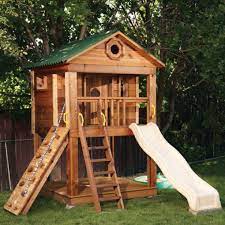 Over a canopied sandbox with simple corner seats there's a own tree house. Playhouse With Slide Ideas On Foter