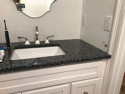 Depending on the type of bathroom vanity you have, you might be able to get away without a backsplash if you are trying to save some cash. Side And Backsplash For Powder Room Bathroom Vanity Dilemma