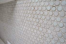 Penny tiles, also known as penny rounds, brings both heritage and cheer to a home. Using A Tile Haze Remover Sealing Grout Caulking Tile Seams Young House Love