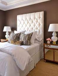The large custom mirror and luminous white walls create an illusion of a larger master bedroom in this charlotte home designed by betsy brown. White And Brown Bedrooms Transitional Bedroom White And Brown Bedroom Girl Bedroom Decor White Home Decor