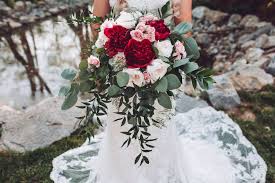These faux floral arrangements pass the test with flying colors. Beautiful Bridal Bouquet With Wine Red Peonies Garden Roses And Blush Pink Roses By Flower Wedding Bouquets Beautiful Bridal Bouquet Pink Flower Arrangements