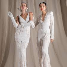 The fitted bodice is highly embellished with ornate beading allover. 30 Best 1920s Inspired Wedding Dresses Of 2021