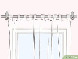 A green circle with a white checkmark in the center. How To Hang Curtains With Command Hooks With Pictures Wikihow