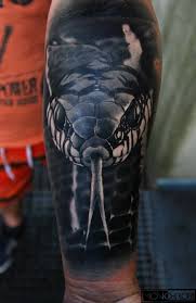 A snake tattoo is one of the coolest and most badass designs out there. Krakow Realistic Snake Snaketattoo Tattoo Tattoos Blackandwhitetattoo Realistictattoo Monochromtattoo Tattoos Snake Tattoo Great Tattoos
