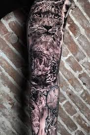 Black And Grey Realism Tattoo Sleeve Black And Grey Nature And Snow Leopard Full Sleeve Tattoo Realistic Big Cats Tattoo By John Hudic Leopard Tattoos Big Cat Tattoo Sleeve Tattoos
