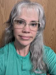 Can someone edit this photo into a headshot?