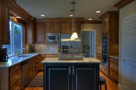 The kitchen cabinet was a term used by political opponents of president of the united states andrew jackson to describe his ginger group, the collection of unofficial advisors he consulted in parallel to the united states cabinet (the parlor cabinet. Lovely Classic Kitchen With Cherry Cabinets And A Black Painted Island Cost Details For This Cabinetry Classic Kitchens Cherry Cabinets Kitchen Cool Kitchens