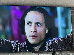 The image presents Hun (the man with crossed hands) attending a Purple  Dragons meeting, a gang that was now working for the Foot Clan and wanted  them all to know there was