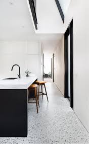 A Black And White Kitchen With Matt Polished Concrete Floors Concrete Floor Concretefloor Concrete Kitchen Floor Kitchen Flooring Polished Concrete Kitchen