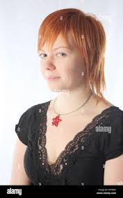 Jeune fille aux cheveux rouges avec mona-lisa smile Photo Stock