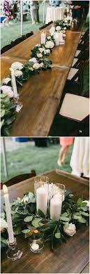 Outdoor Wedding Reception Table Decor Long Wooden Tables Garlands Of Pastel Flroals Wedding Reception Table Decorations Outdoor Wedding Tables Wedding Table