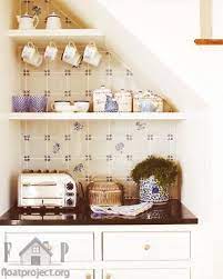 27 Genius Ways To Use The Space Under Your Stairs Stairs In Kitchen Stair Storage Open Kitchen Shelves