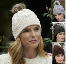 The most common knit hat fur ball material is polyester. Irish Wool Cable Knit Hat With Faux Fur Pom