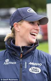 Zara Phillips enjoys a day out at Burghley Horse Trials as a toddler givers  her a sticker