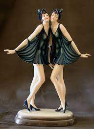 Pair of art deco cast iron cat figurines. A Beautiful Rare Art Deco Figure By Dakon For Goldscheider Austria C1920s Depicting The Dolly Sisters Art Deco Fashion Art Deco Art Deco Sculpture