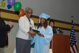 School district hosts early graduation ceremony for seniors with deploying  parents
