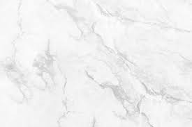 Young black woman in an office smiling to camera, close up american black bear. Premium Photo White Marble Texture Background High Resolution