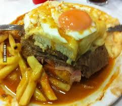 Here S A Francesinha Northern Portugal Traditional Dish Heart Attack On A Plate Food Stuffed Peppers Around The World Food