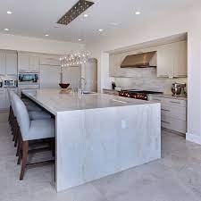 Oversized Islands With An Overhang Increase A Kitchen S Functionality And Entertaining Quartz Kitchen Countertops Quartzite Countertops Kitchen Kitchen Design