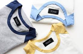 This intricate pattern features stylised stars, diamonds, arrows and waterbug motifs in a palette that echoes the white and grey bark of aspen trees against a blue sky. Howlin Knitwear Howlin