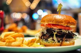 Jimmy buffett (born december 25, 1946 in gulf shores, alabama, united states) is a singer/songwriter, best known for his island escapism lifestyle and music including hits such as margaritaville and come monday. Burgers At Jimmy Buffett S Margaritaville For National Burger Month Tasty Chomps A Local S Culinary Guide