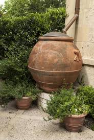 Beautiful Olive Oil Urn Used As Rain Catcher In One Of Our Featured Gardens