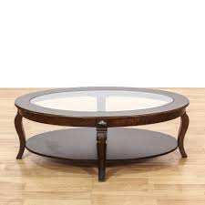 This Oval Coffee Table Is Featured In A Solid Wood With A Glossy Dark Stained Finish This Contempora Coffee Table Contemporary Coffee Table Glass Coffee Table