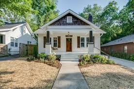 White Brick Craftsman With Dark Wood Accent Colors Craftsman Bungalow Exterior Bungalow Exterior Craftsman Exterior