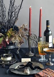 This floral fall table centerpiece from goes for sophistication while still honoring the season. 20 Halloween Dining Table Setting Decor Ideas