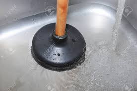 plunger and clogged kitchen sink. pipe