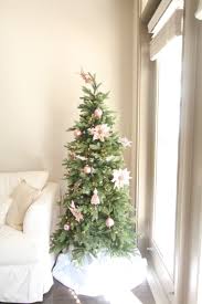 Christmas tree made of breast cancer ribbon symbol on grey background. Breast Cancer Awareness During Christmas Our Pink Christmas Tree