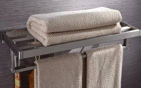 Fold the towel in half by folding the length of the towel on top of itself, creating four layers. Free Shipping Stainless Steel Bath Towel Rack Folding Movable Bath Towel Holder Double Towel Rails Bars Wall Mou Steel Bath Bath Towel Racks Double Towel Rail