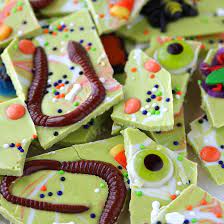 Easy No Bake Halloween Candy Bark Recipe Filled With Sprinkles Gummy Worms Bugs And Eyeballs A Pe Fun Halloween Treats Halloween Candy Bark Halloween Treats
