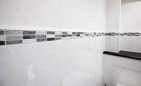 Lovely Mosaic Border Tiles In A Mix Of Greys To Add Texture To The Finish Mosaic Tiles Grey Luxury Bathroom Tiles Tile Bathroom Small Toilet Room