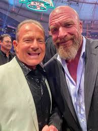 WWF Tag Team Veteran Brian Blair (The Killer Bees) with Triple H, while  Irwin R. Schyster is seen in the back