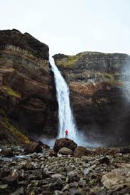 Download Premium Image Of Man In A Red Jacket At The Haifoss Waterfall Man Images Waterfall Image